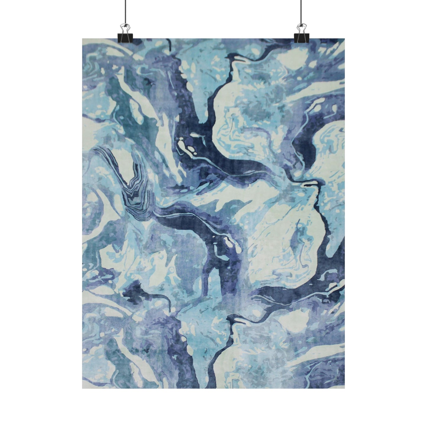 Abstract blue and white patterned paper on a white background