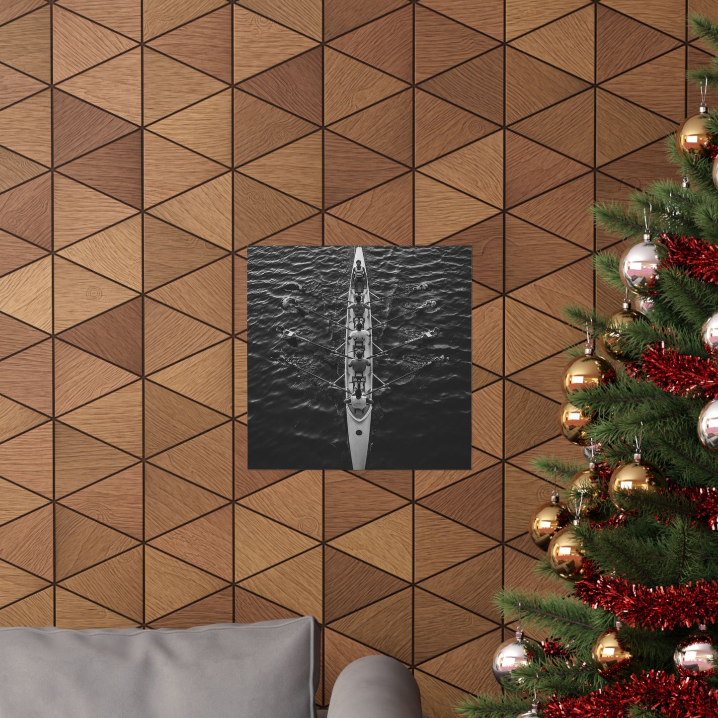 Wooden wall with geometric pattern, framed artwork, and Christmas tree with decorations.