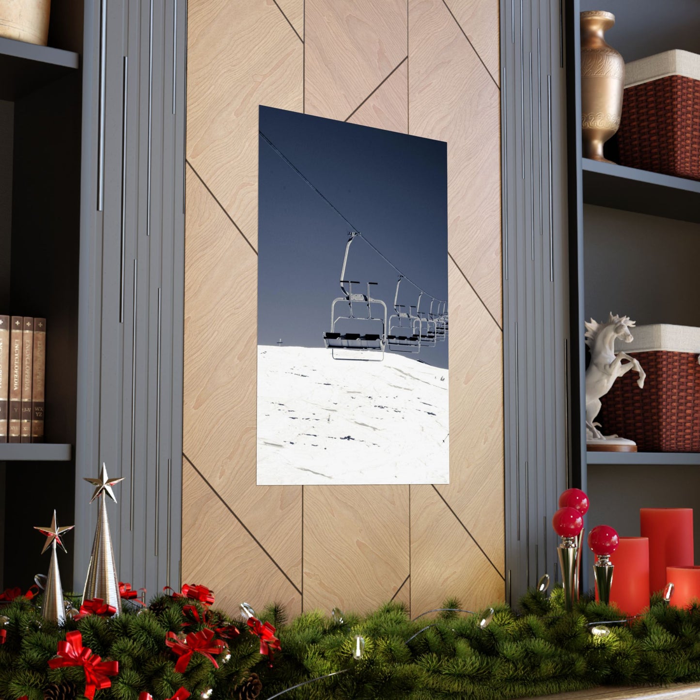 Poster of a ski lift on a snowy mountain in a room with festive decorations.