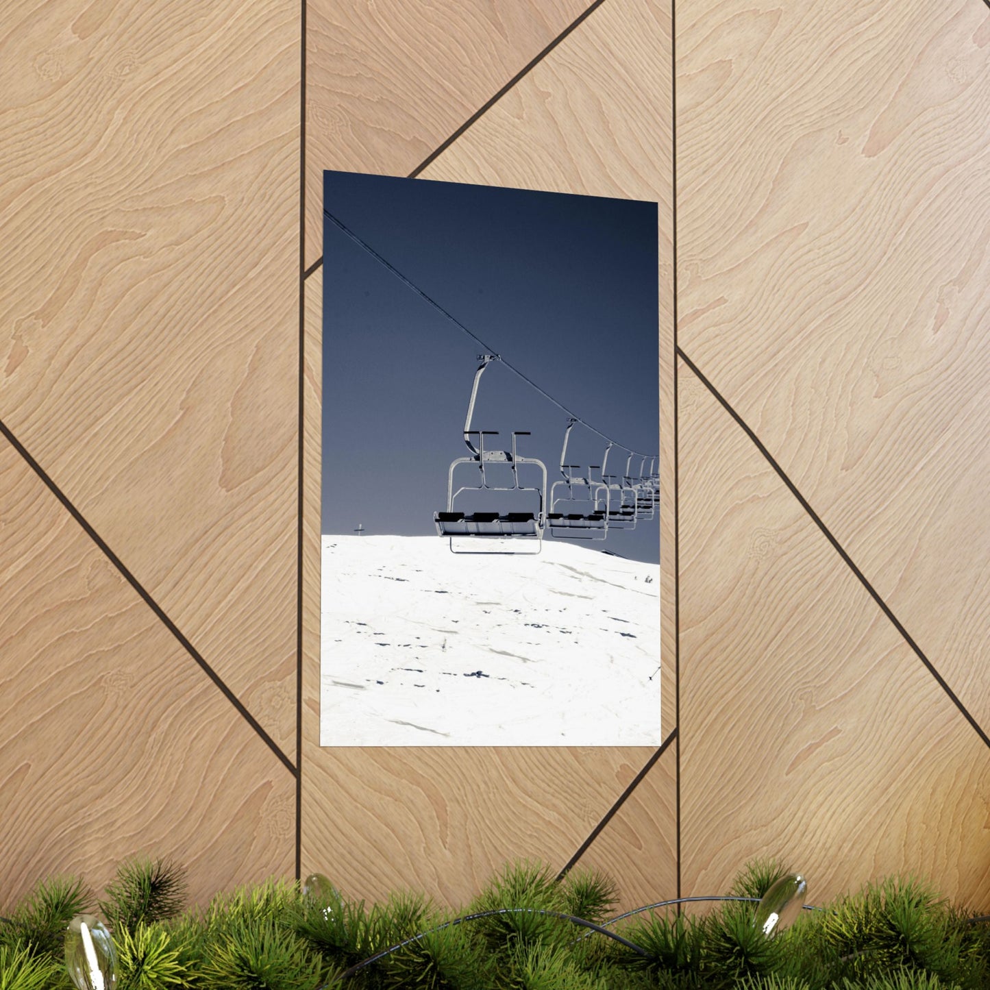 Ski lift against a blue sky on a wooden wall with geometric patterns