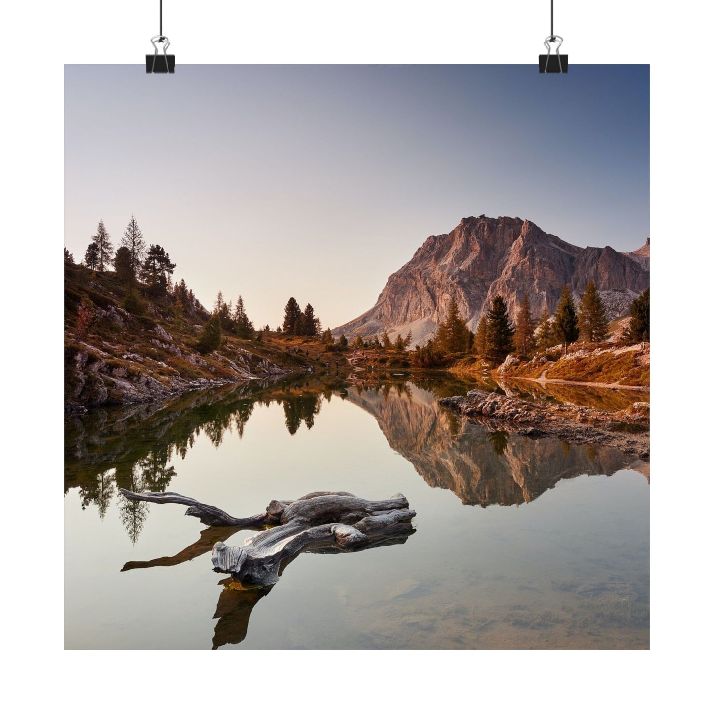 Mountain landscape with a lake and trees at sunset