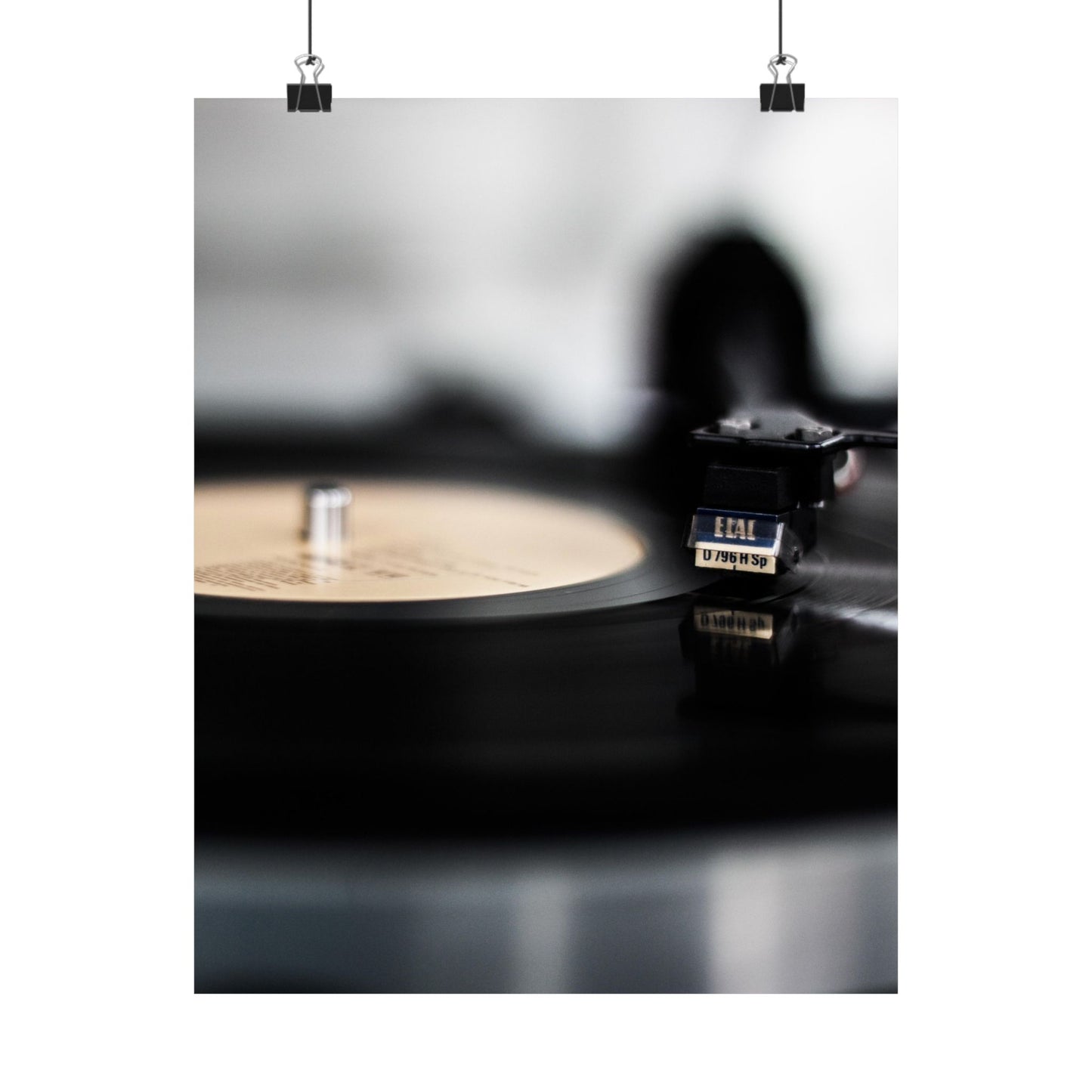 Close-up of a vinyl record player with a record on a turntable