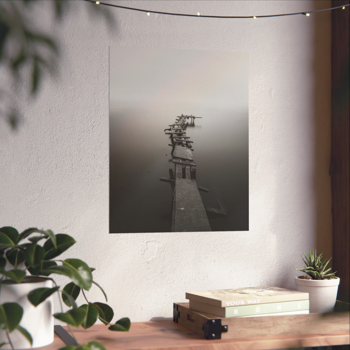 Poster of a dock on a wall with a table and plants in the foreground