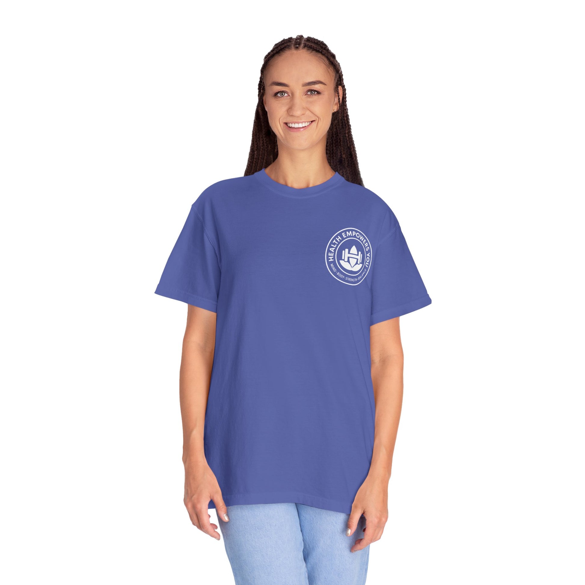 Person wearing a blue t-shirt with a logo on a white background