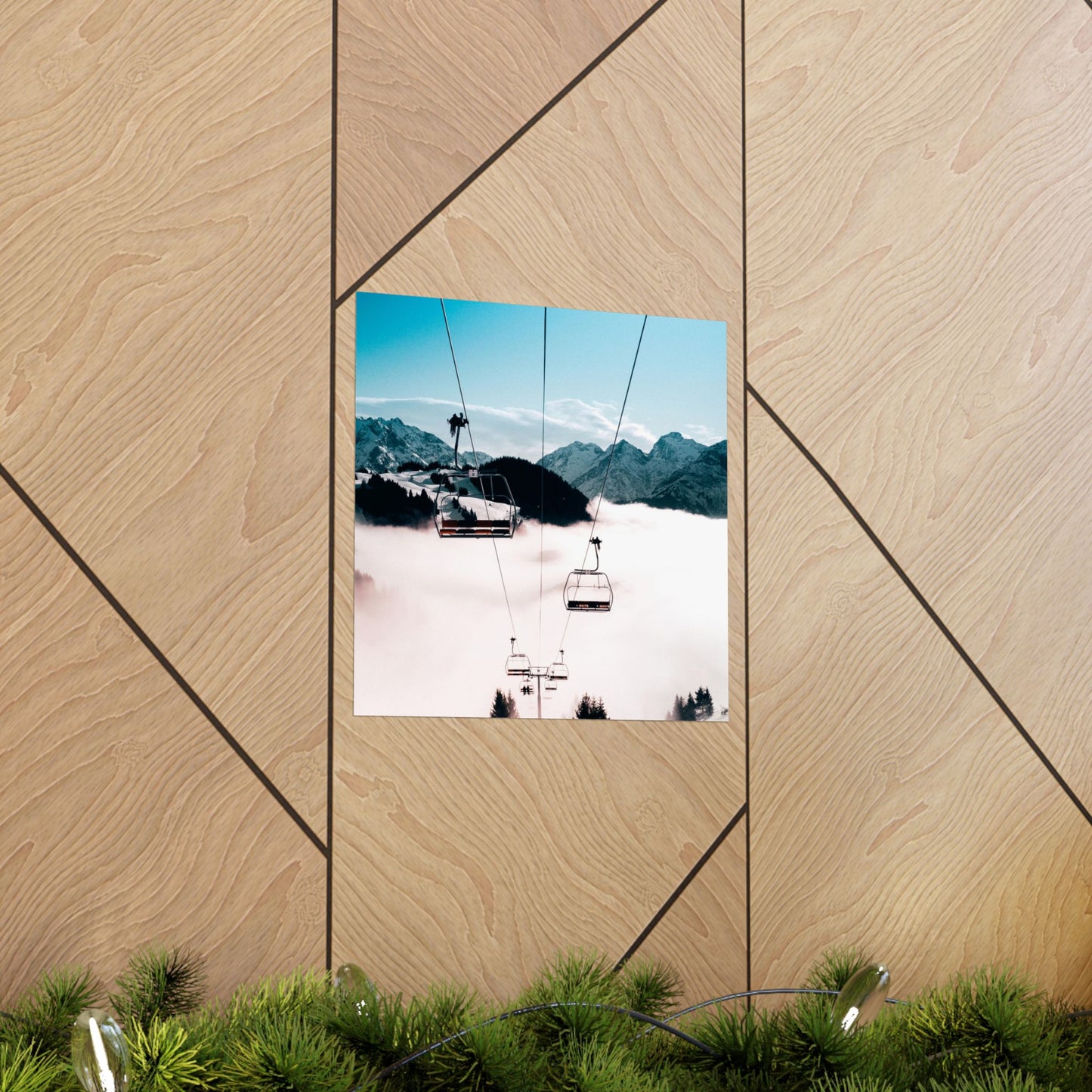 Ski lift with mountains in the background on a wooden panel