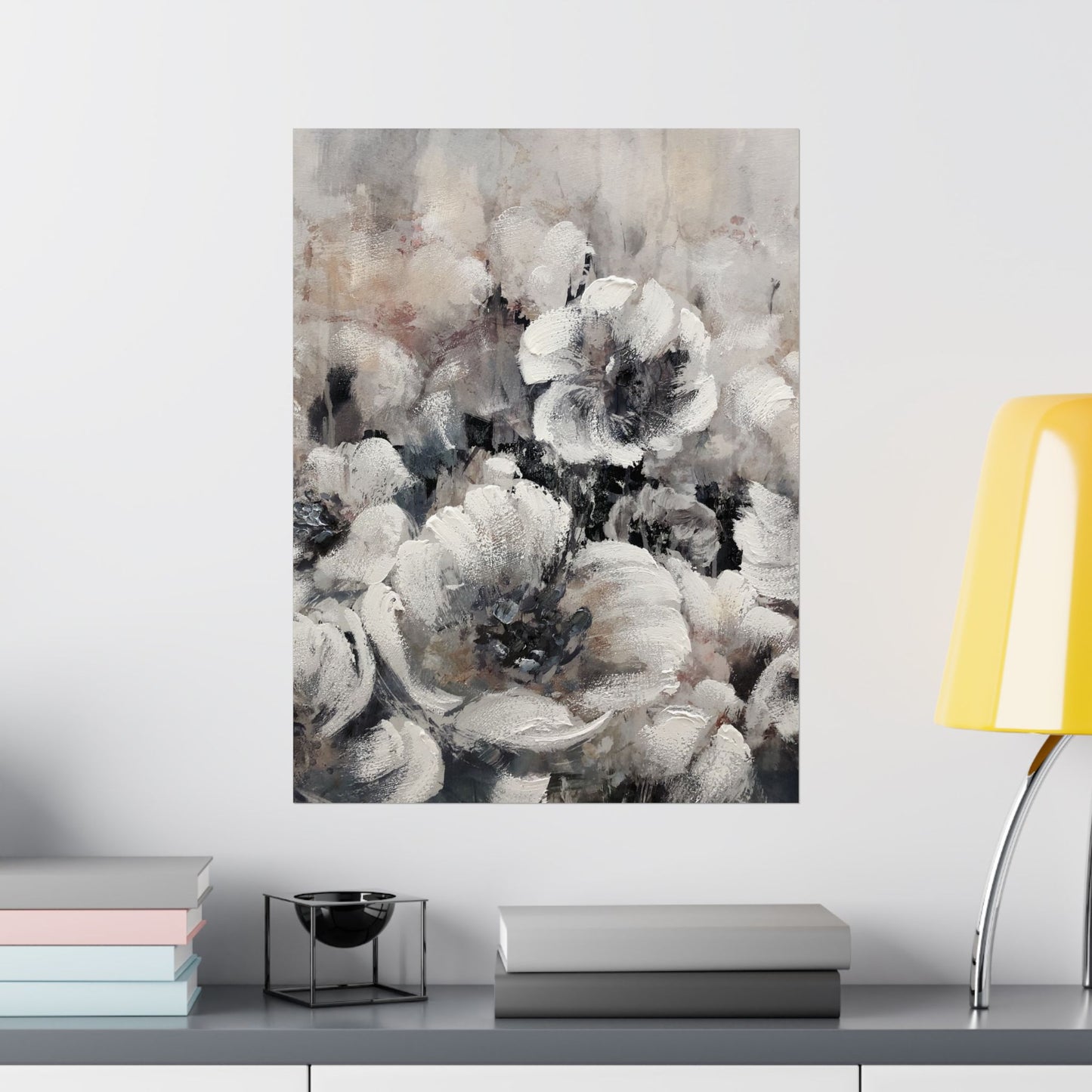 Abstract floral painting on a wall above a shelf with books and decor items.