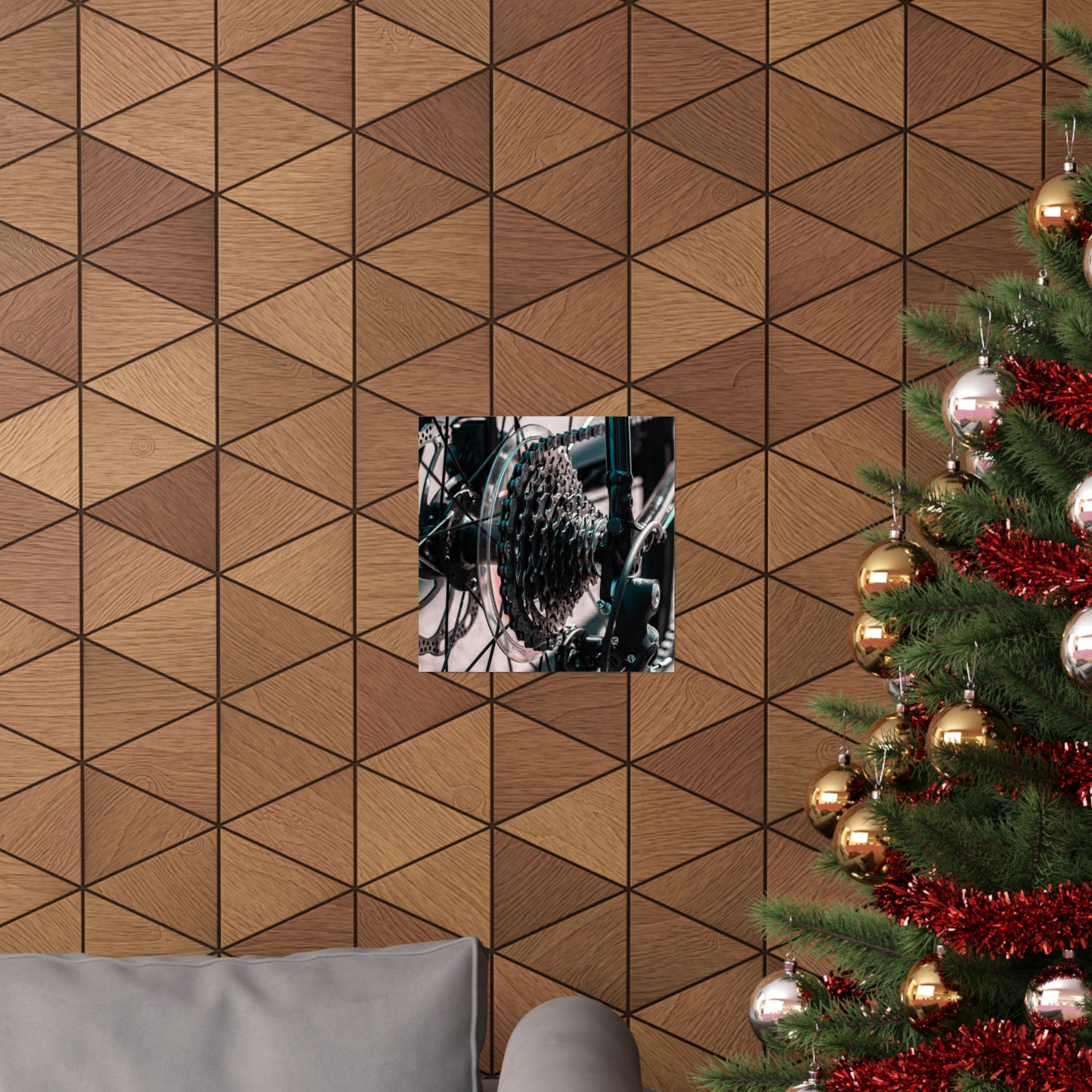 Decorative wall with geometric pattern, framed picture, and Christmas tree with ornaments.
