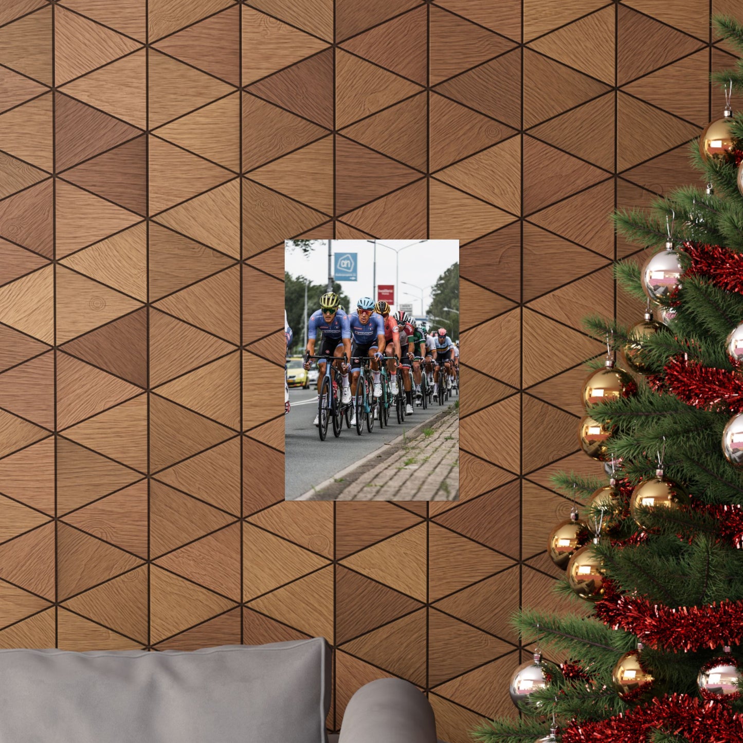 Wooden wall with geometric pattern, mirror reflecting cyclists, and Christmas tree with decorations.