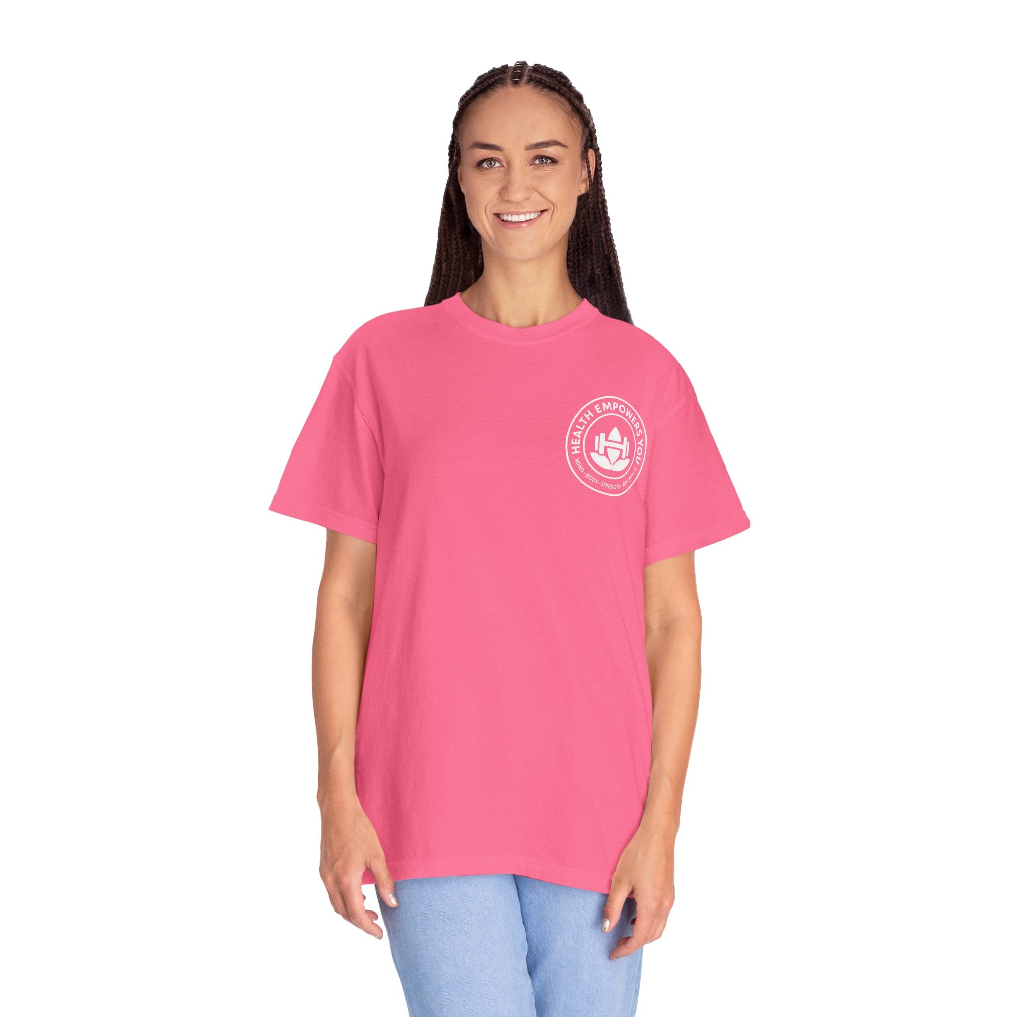 Person wearing a pink t-shirt with a logo on a white background