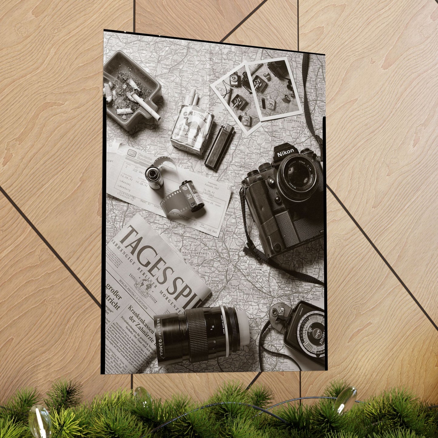 Vintage camera and accessories on a map with Christmas decorations