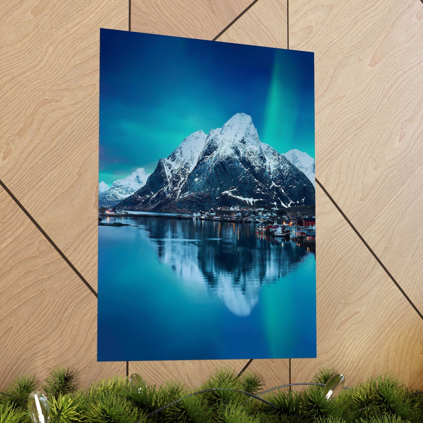 Poster of a mountain landscape with a lake on a wooden surface.