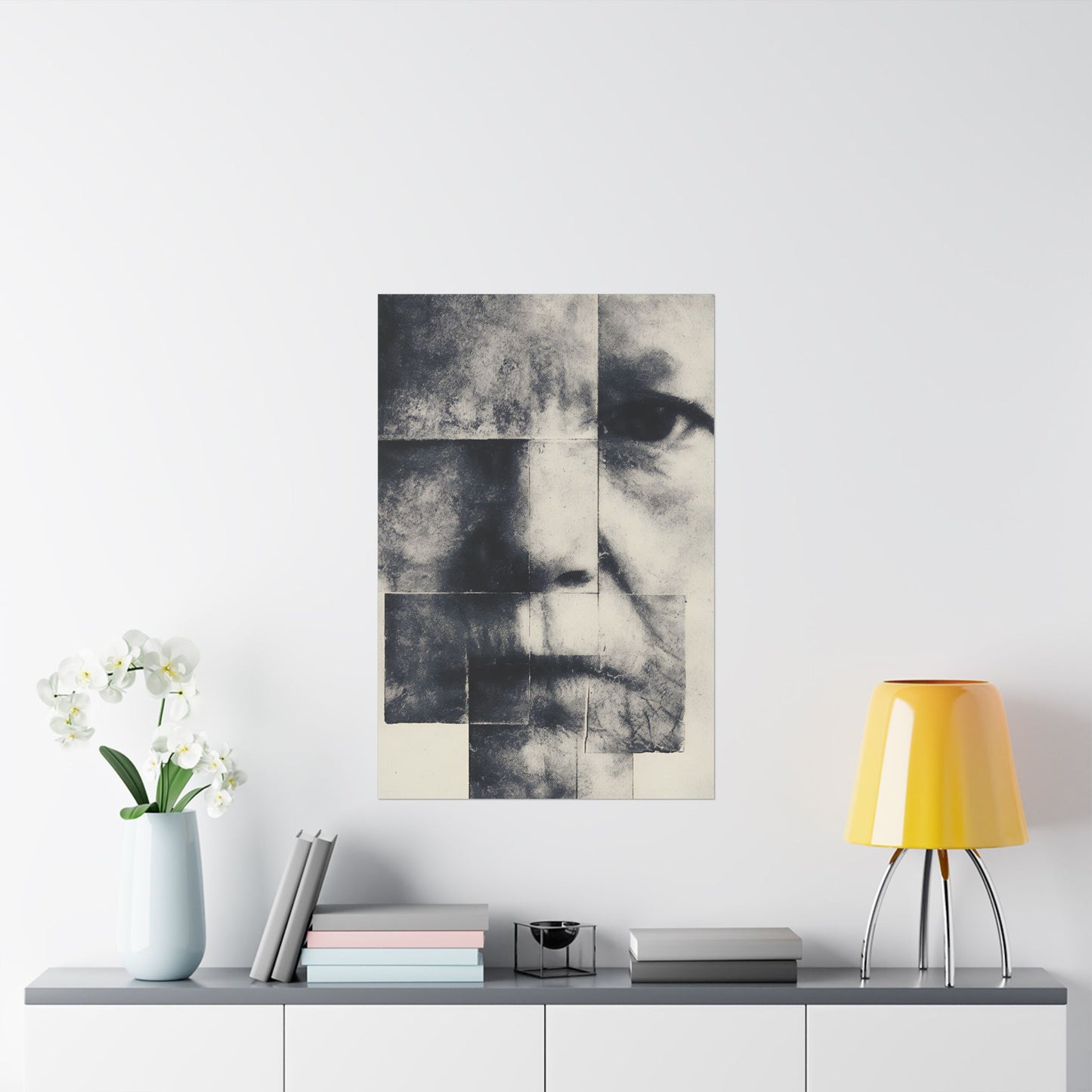 Framed portrait on a wall above a table with decor items