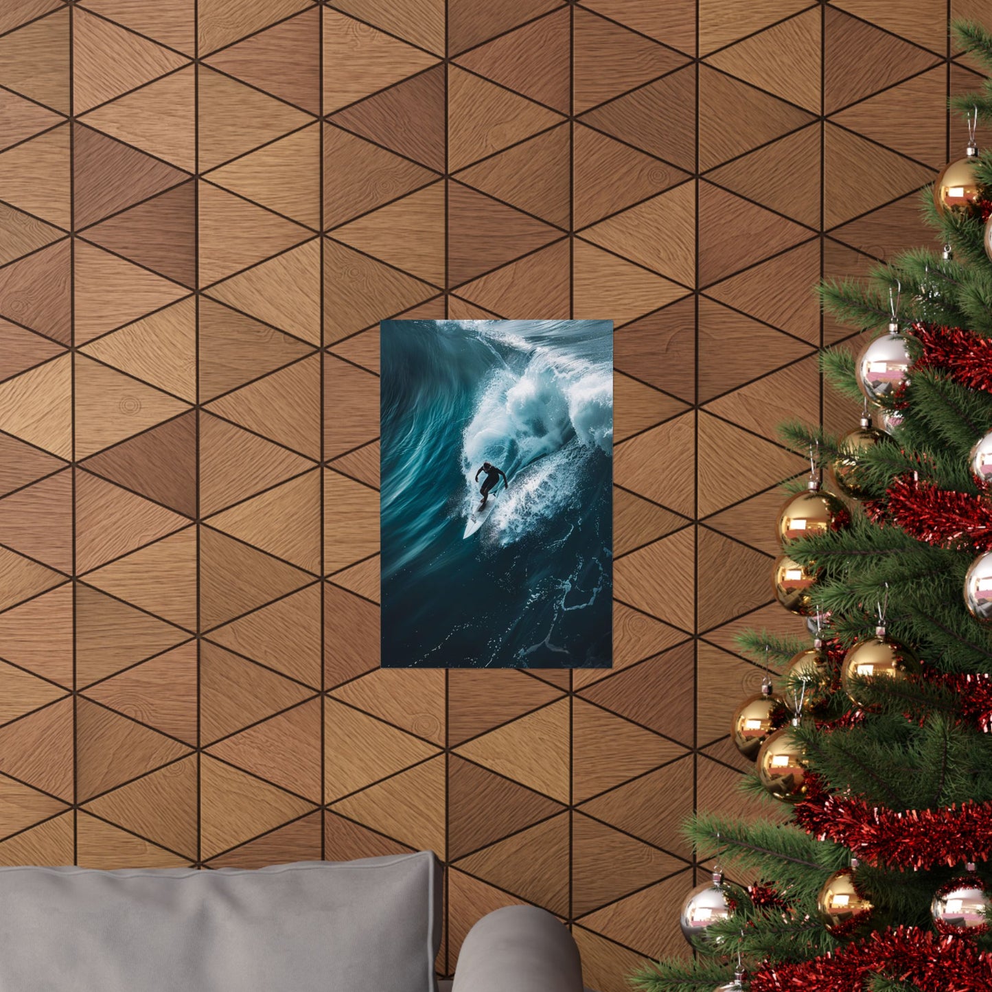 Wall art of a surfer in the ocean on a geometric-patterned wall with a Christmas tree to the right.