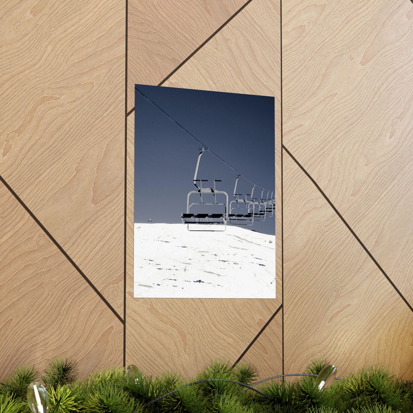 Ski lift against a blue sky on a wooden wall with geometric patterns