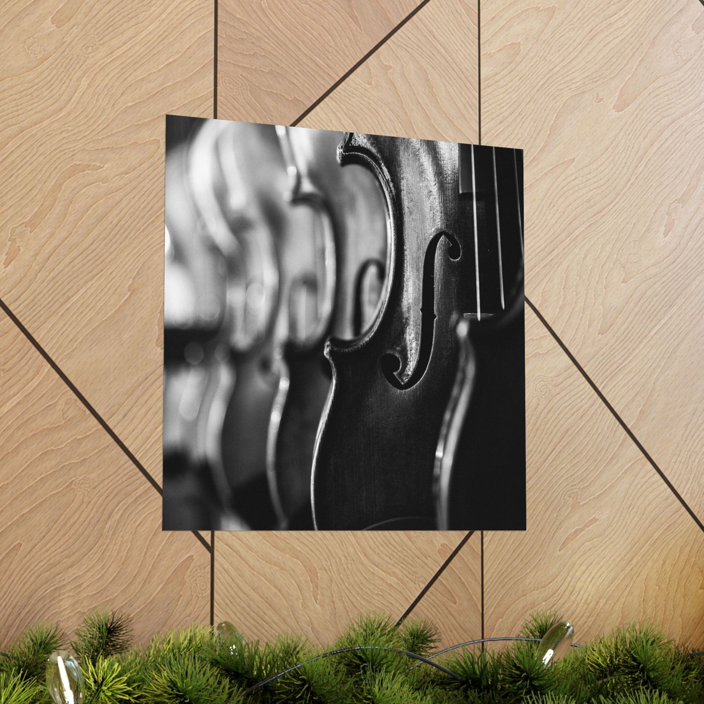 Close-up of a violin's f-hole on a wooden floor with decorative elements.