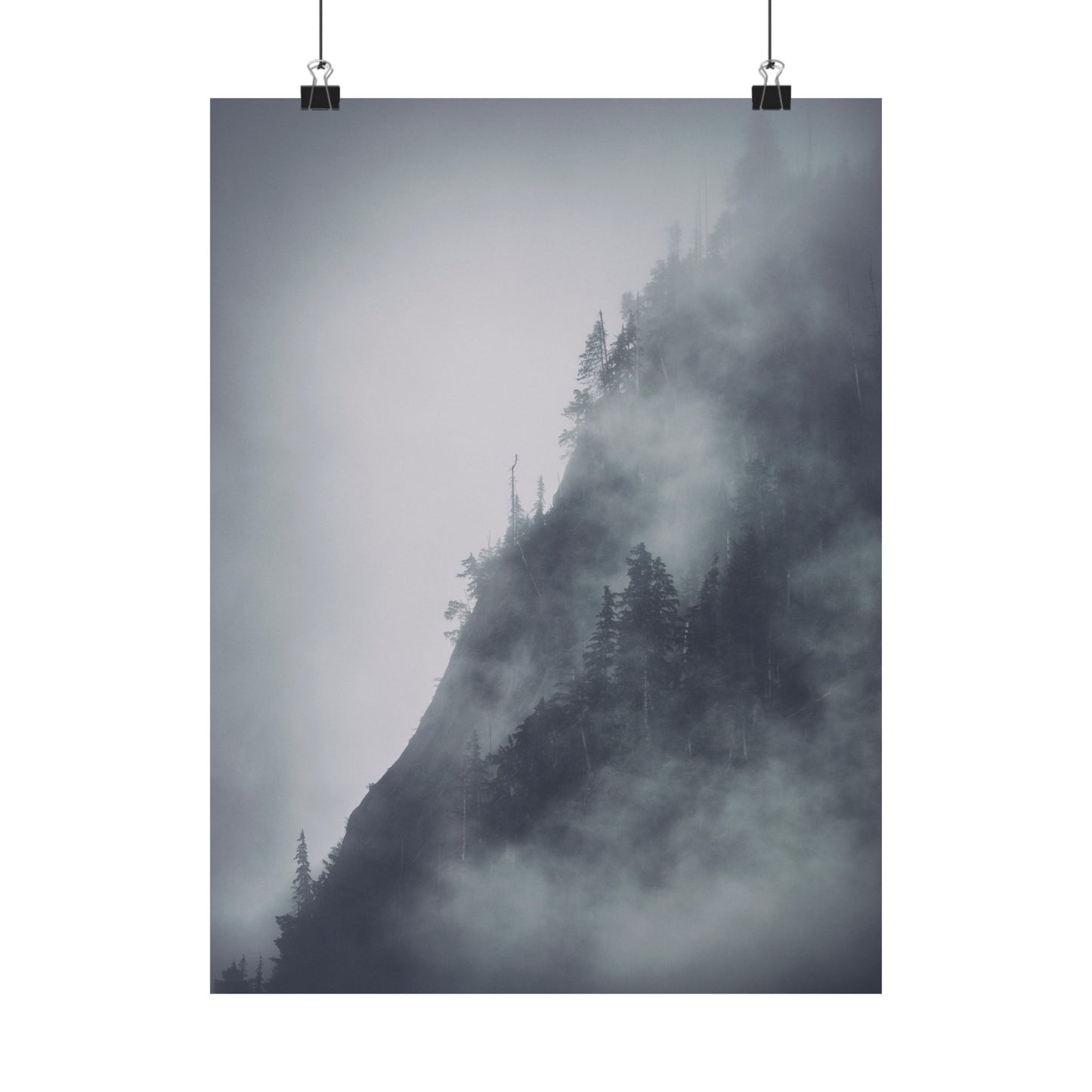Mountain landscape with trees shrouded in mist, hanging on a white background