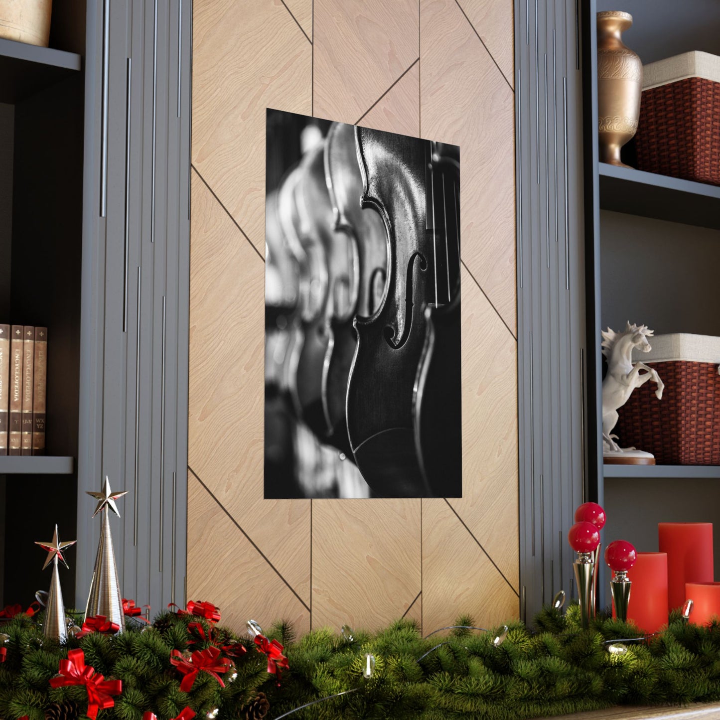 Decorative wall art of a violin on a tiled wall with festive decorations at the bottom.
