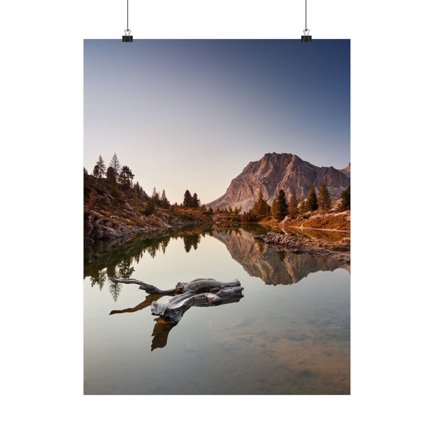Mountain landscape with a lake and trees at sunset