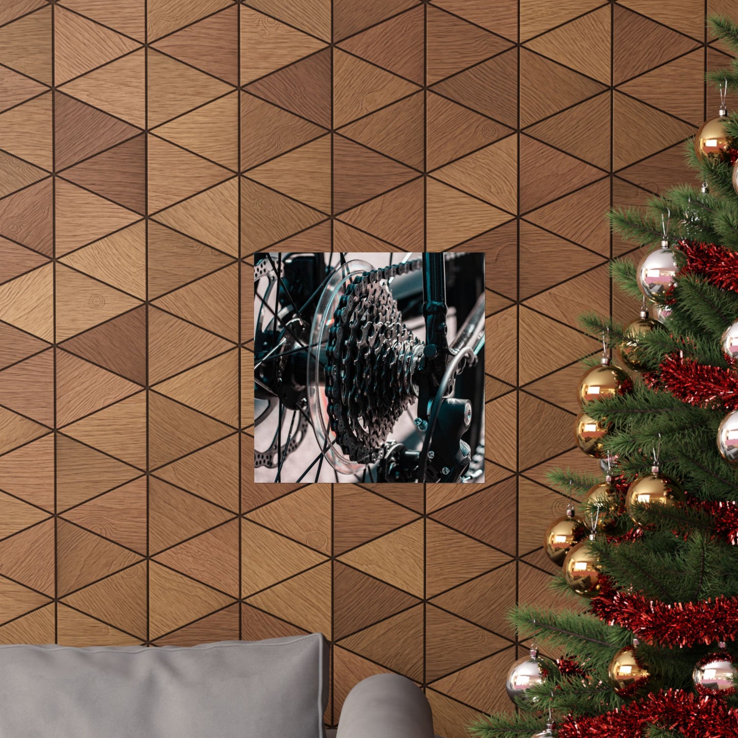 Decorative wall mirror on a geometric-patterned wall with a Christmas tree to the right.