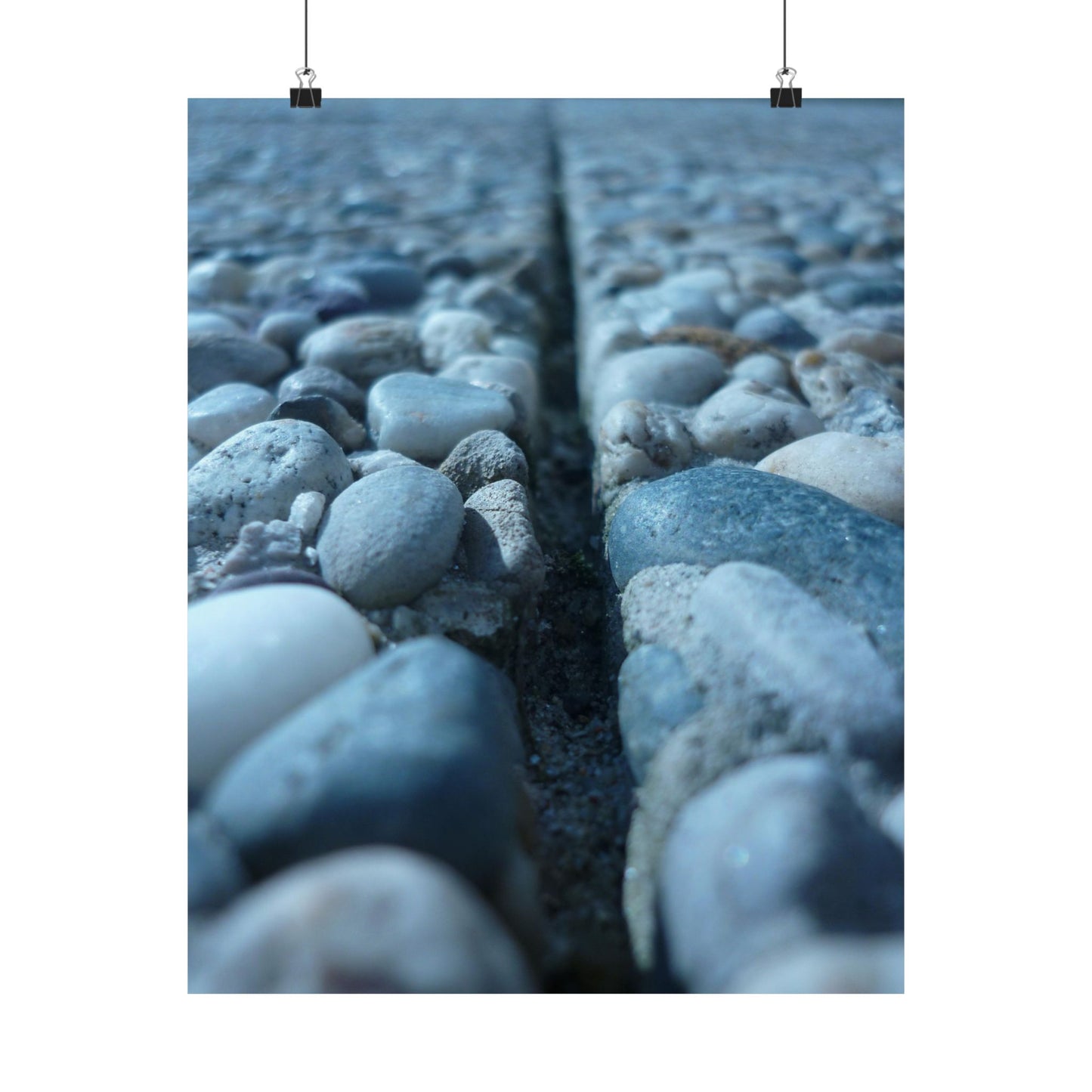 Close-up of pebbles with a crack running through them