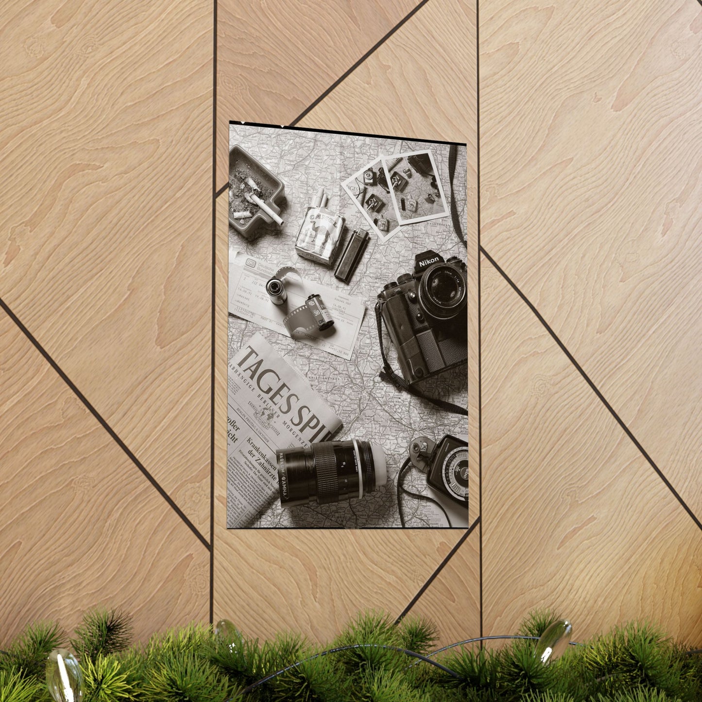 Phone case with vintage camera and film design on a wooden surface