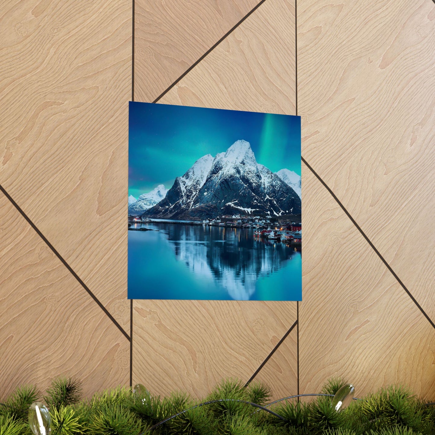 Poster of a mountain and lake scene on a wooden surface