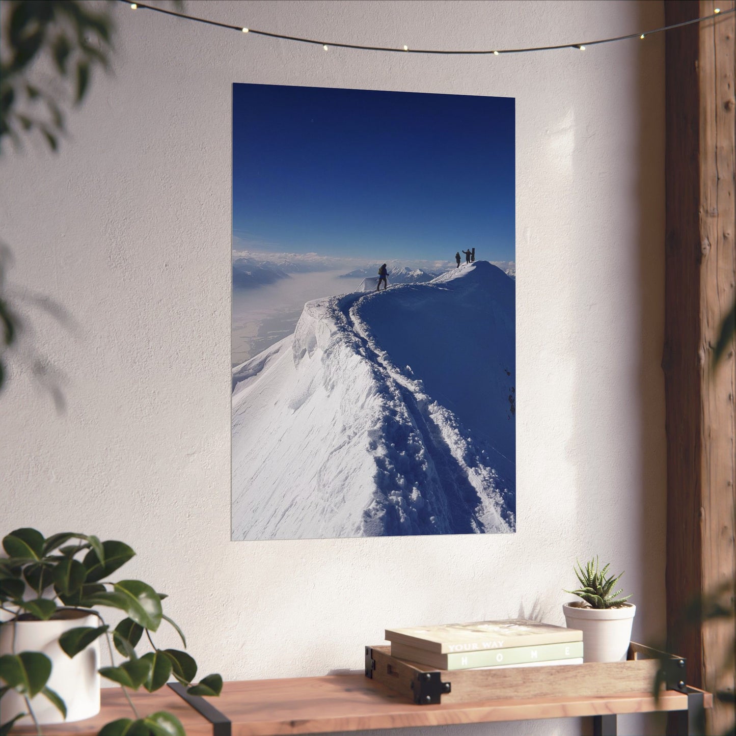 Poster of a snowy mountain landscape on a wall with decorative elements.