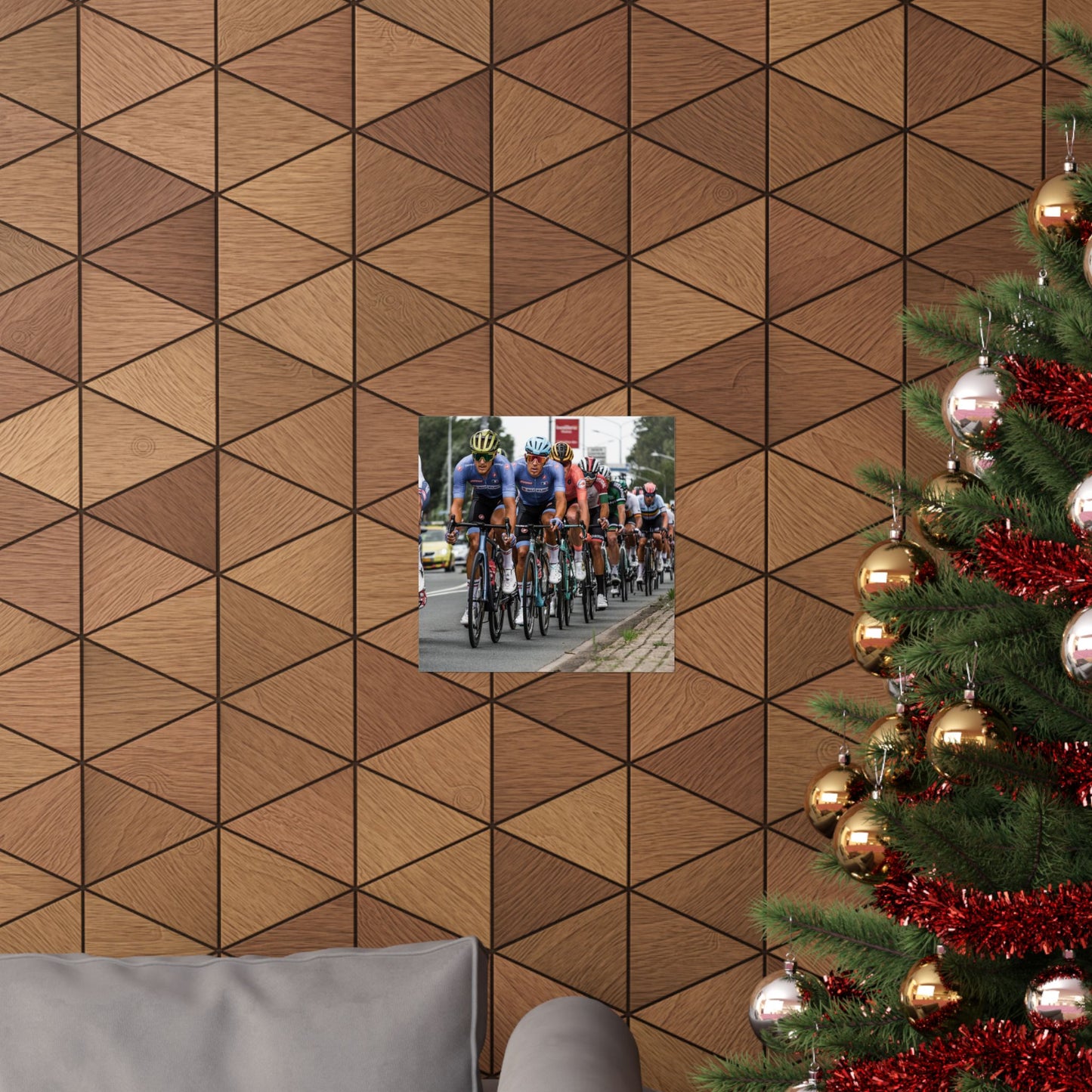 Wooden wall with geometric pattern, inset photo of cyclists, and Christmas tree with decorations.
