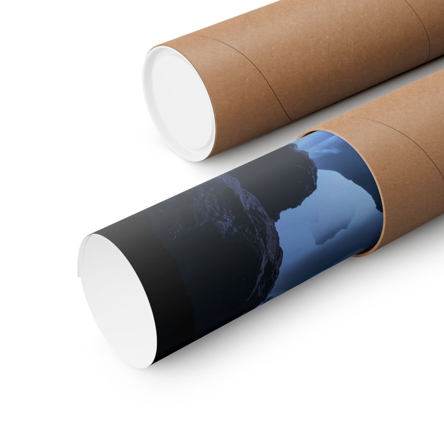 Two cardboard tubes with a printed design of a mountain and sky on a white background