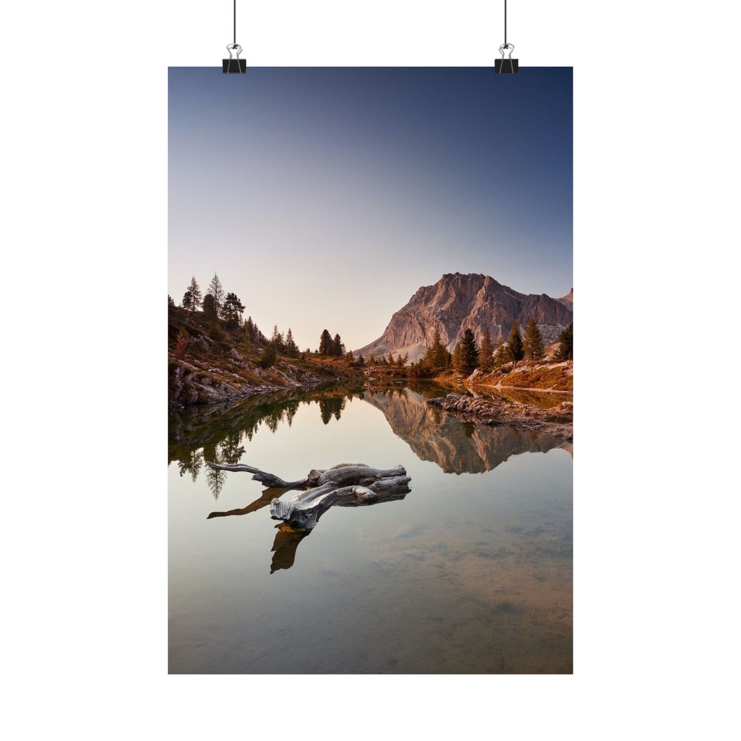 Mountain landscape with a lake and a log in the foreground