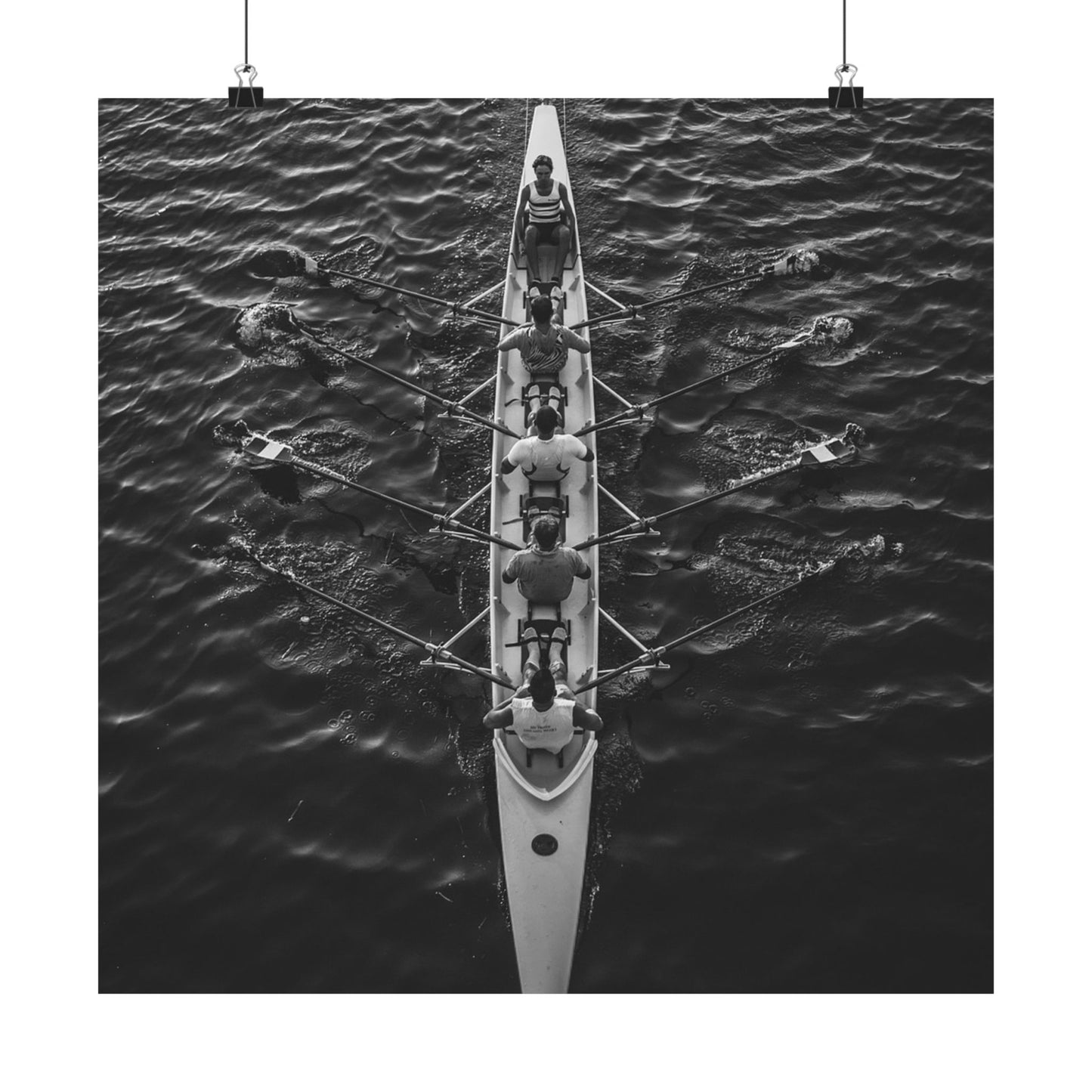 Rowing team in a boat on water from an aerial perspective