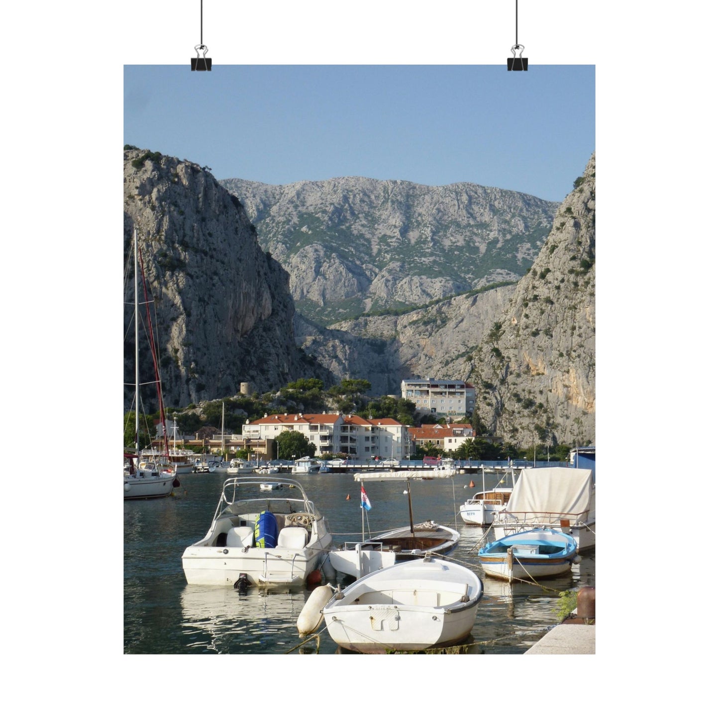Harbor scene with boats and mountains in the background