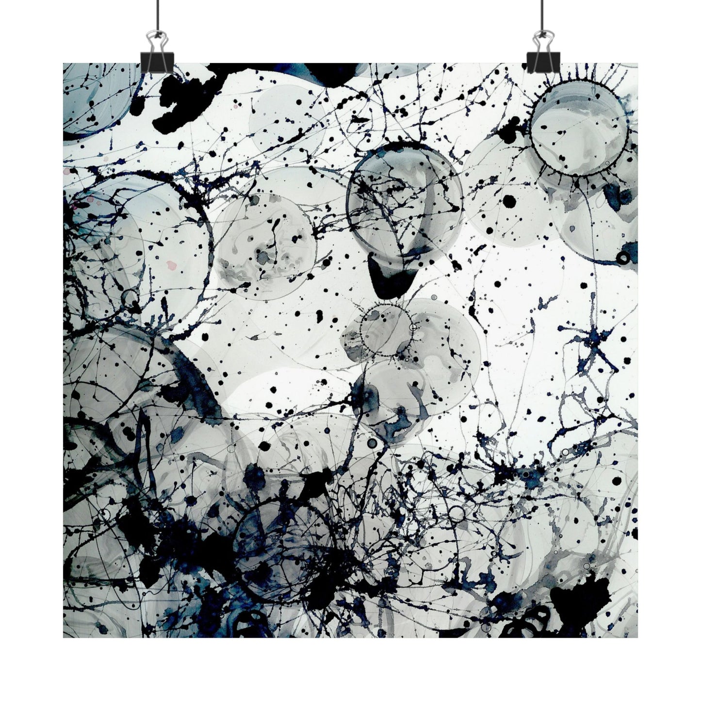 Abstract art print with black and blue splashes on a white background