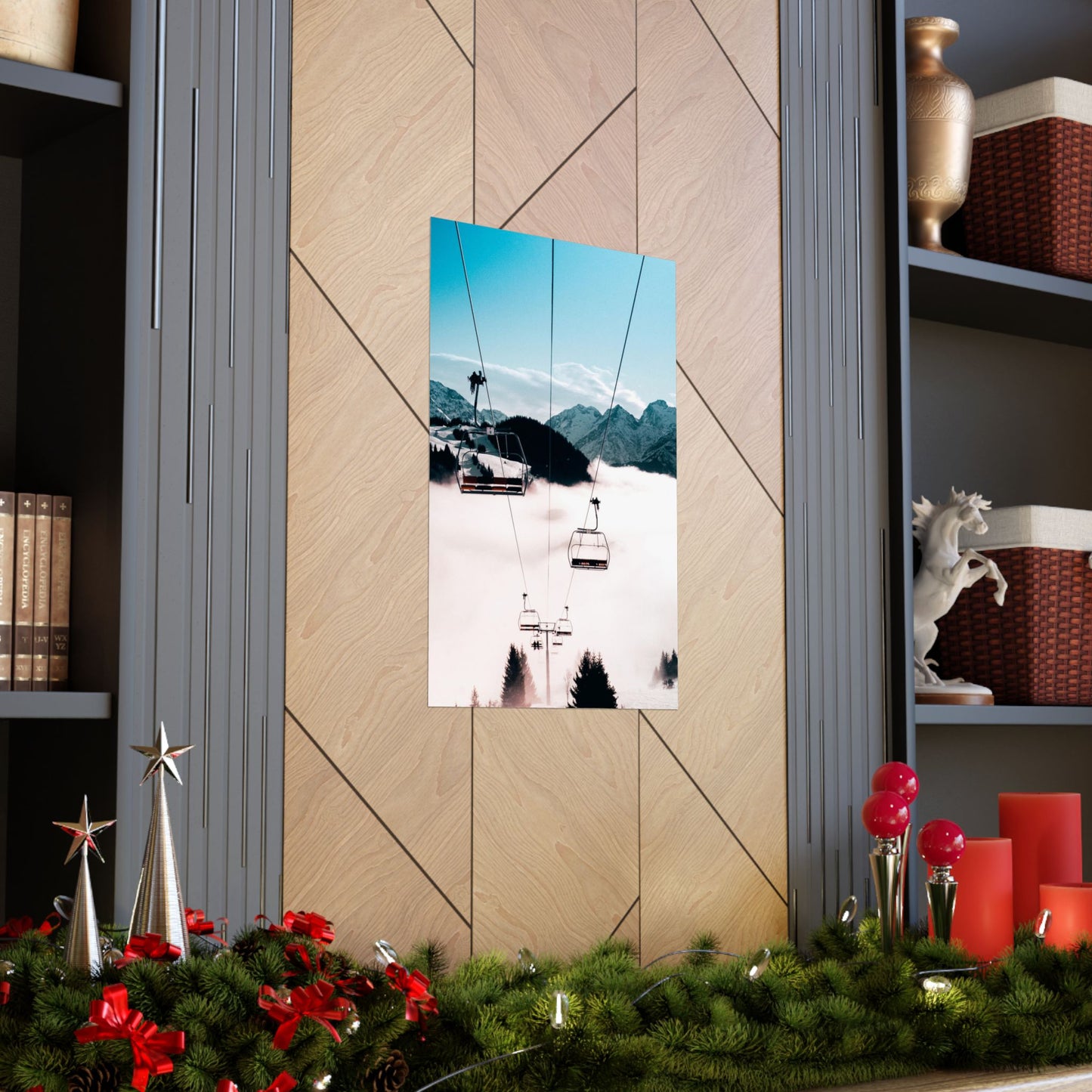 Decorative wall art of a snowy mountain scene with ski lifts on a wooden wall, surrounded by festive decorations.