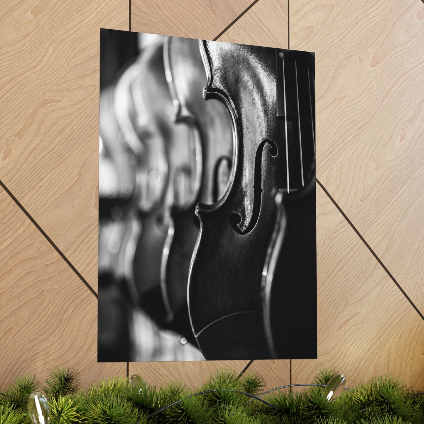 Close-up of a violin's f-hole on a wooden floor with decorative elements.
