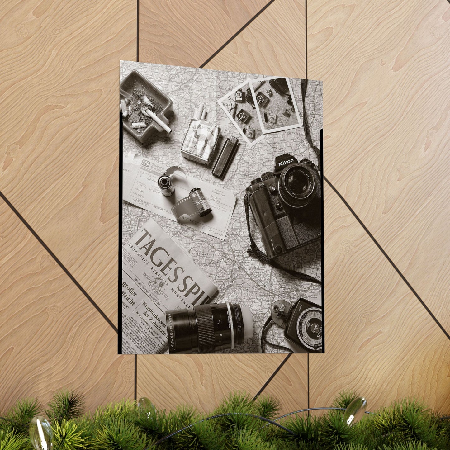 Poster with vintage camera and photo album design on a wooden floor.