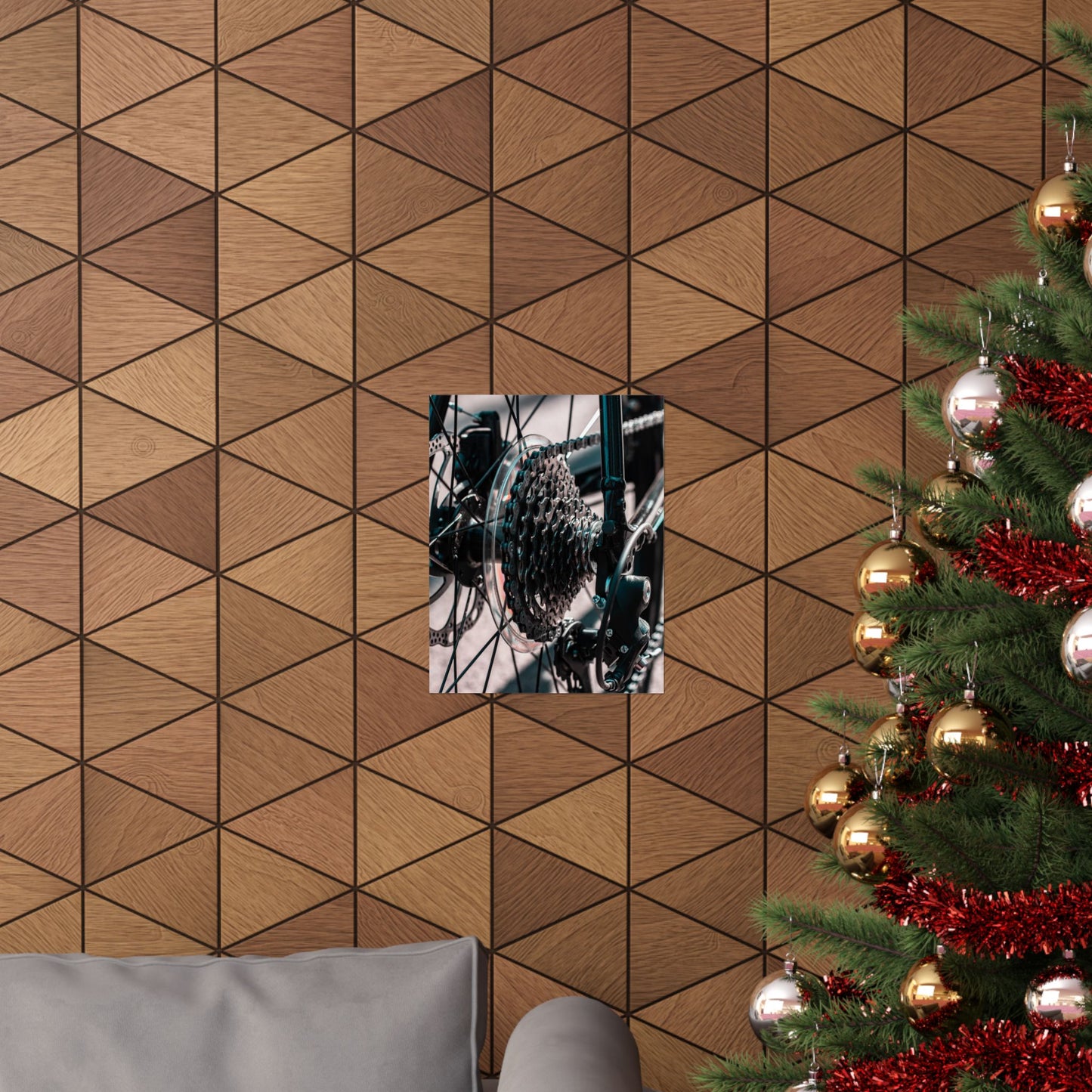 Wooden wall with geometric pattern, framed picture, and Christmas tree with decorations.