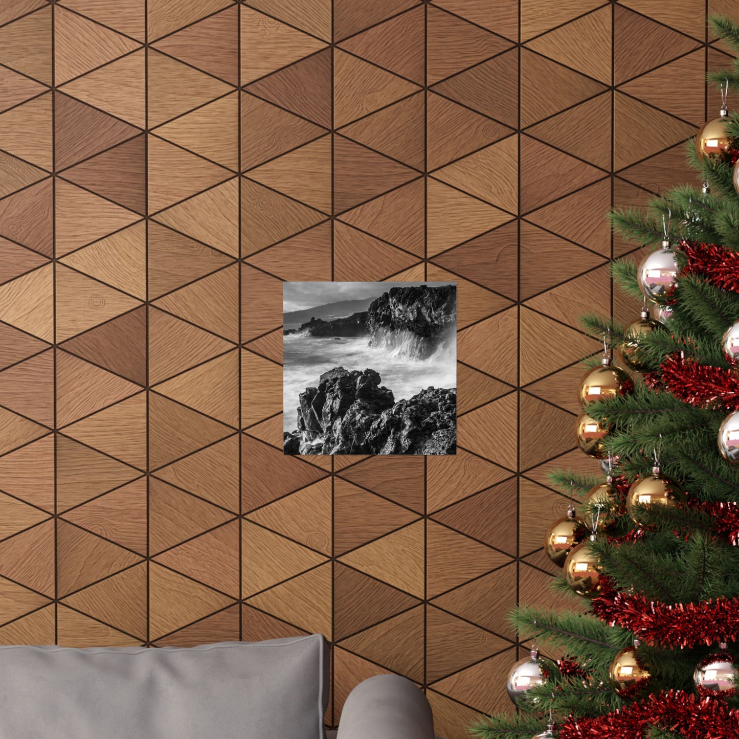 Wooden geometric wall paneling with a Christmas tree and framed picture on a wall.