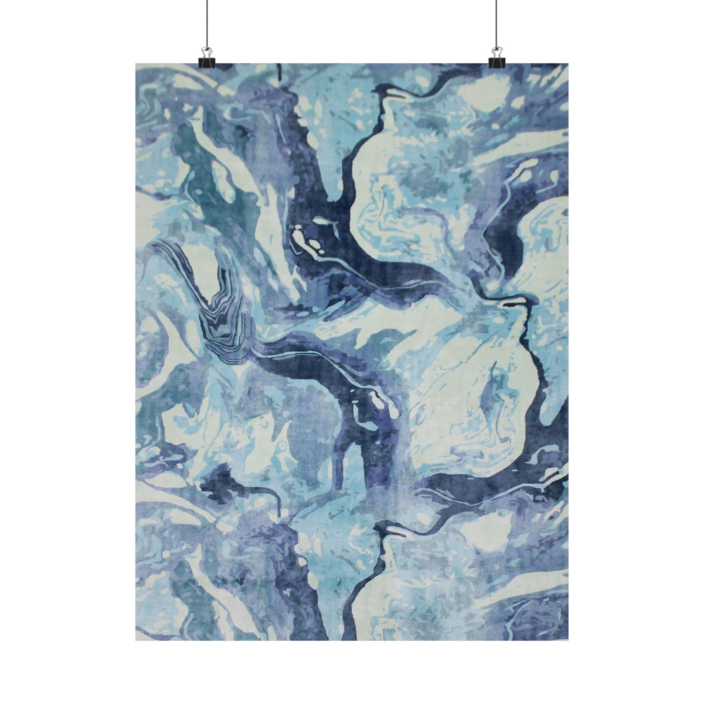 Abstract blue and white patterned fabric hanging on a white background
