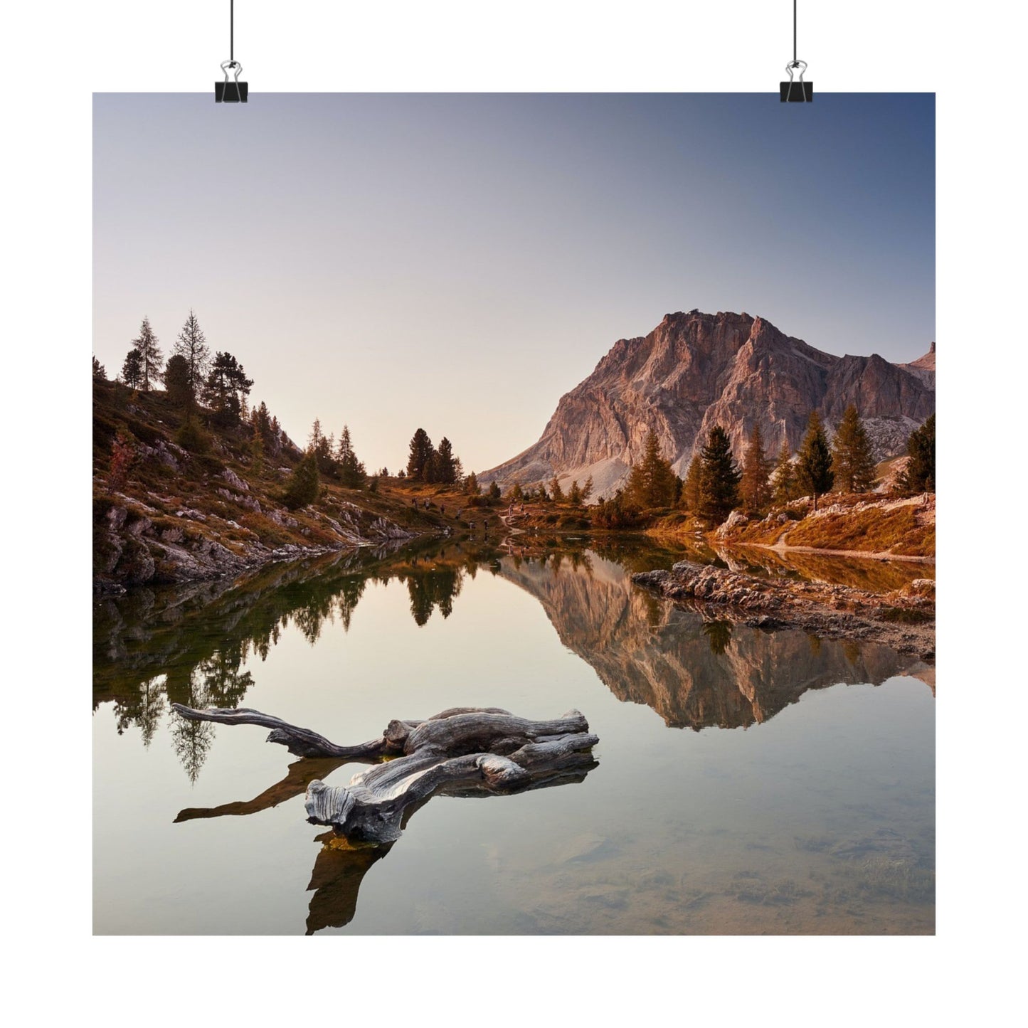 Mountain landscape with a lake and trees at sunset