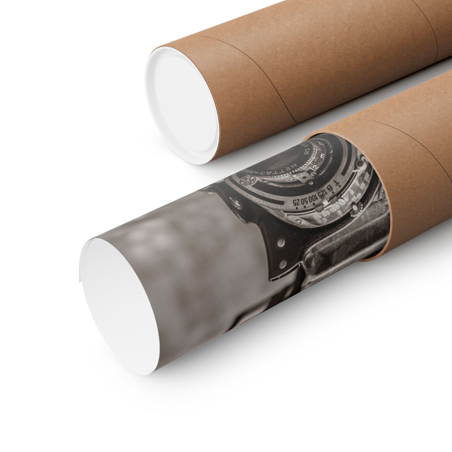 Two cardboard tubes with a printed design of a vintage camera on a white background