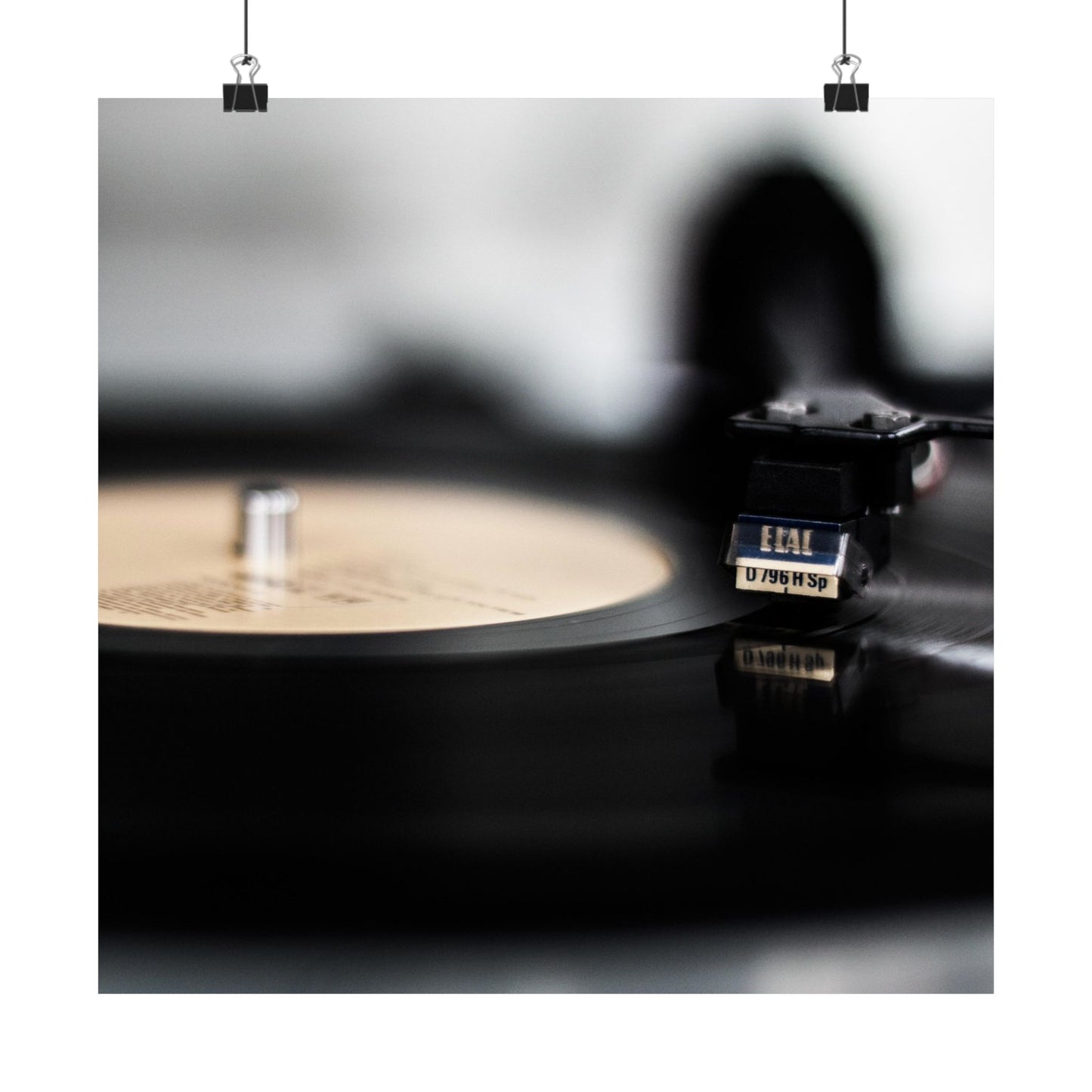 Close-up of a vinyl record player with a record on a turntable