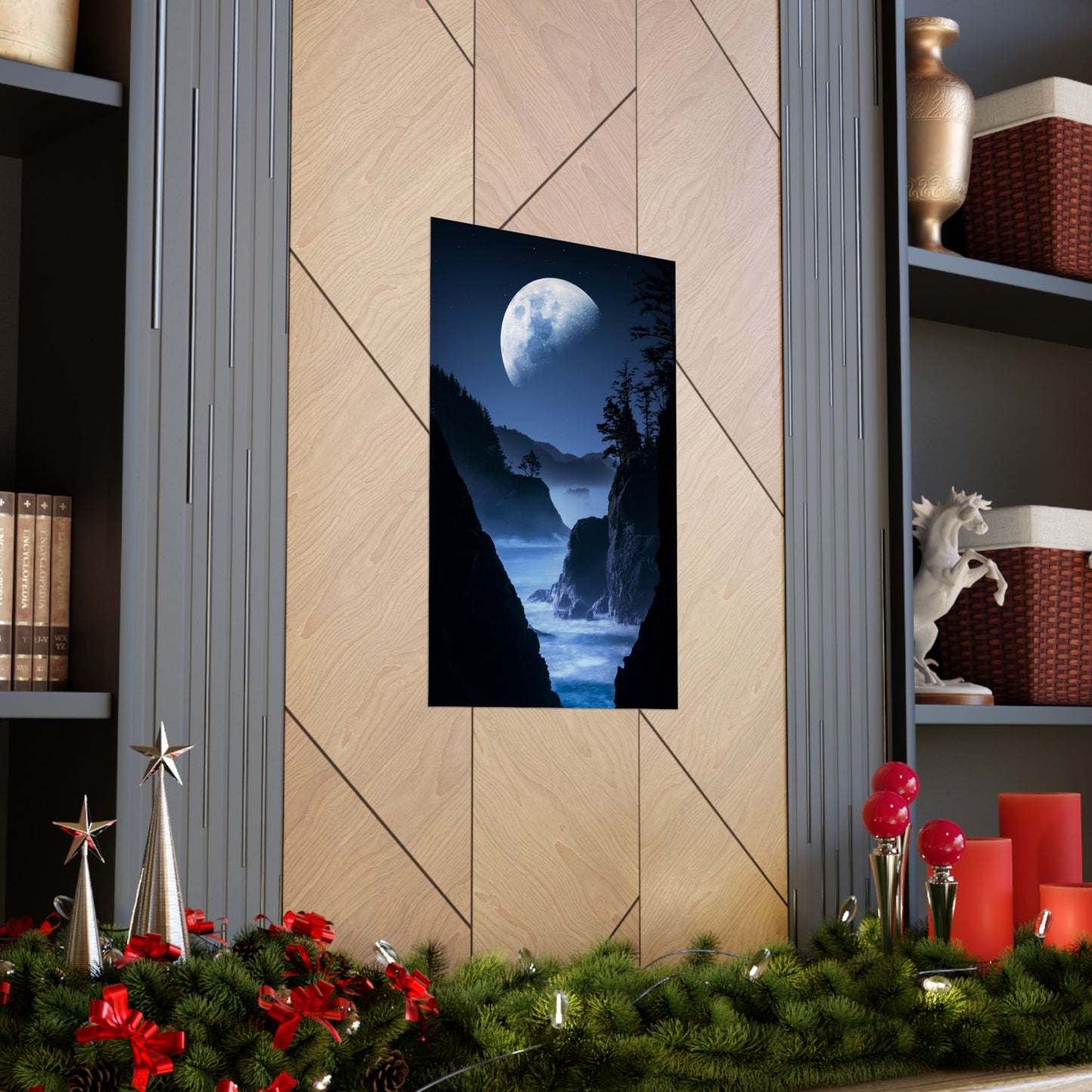 Decorative wall art of a moonlit landscape on a wooden wall with festive decorations at the bottom.