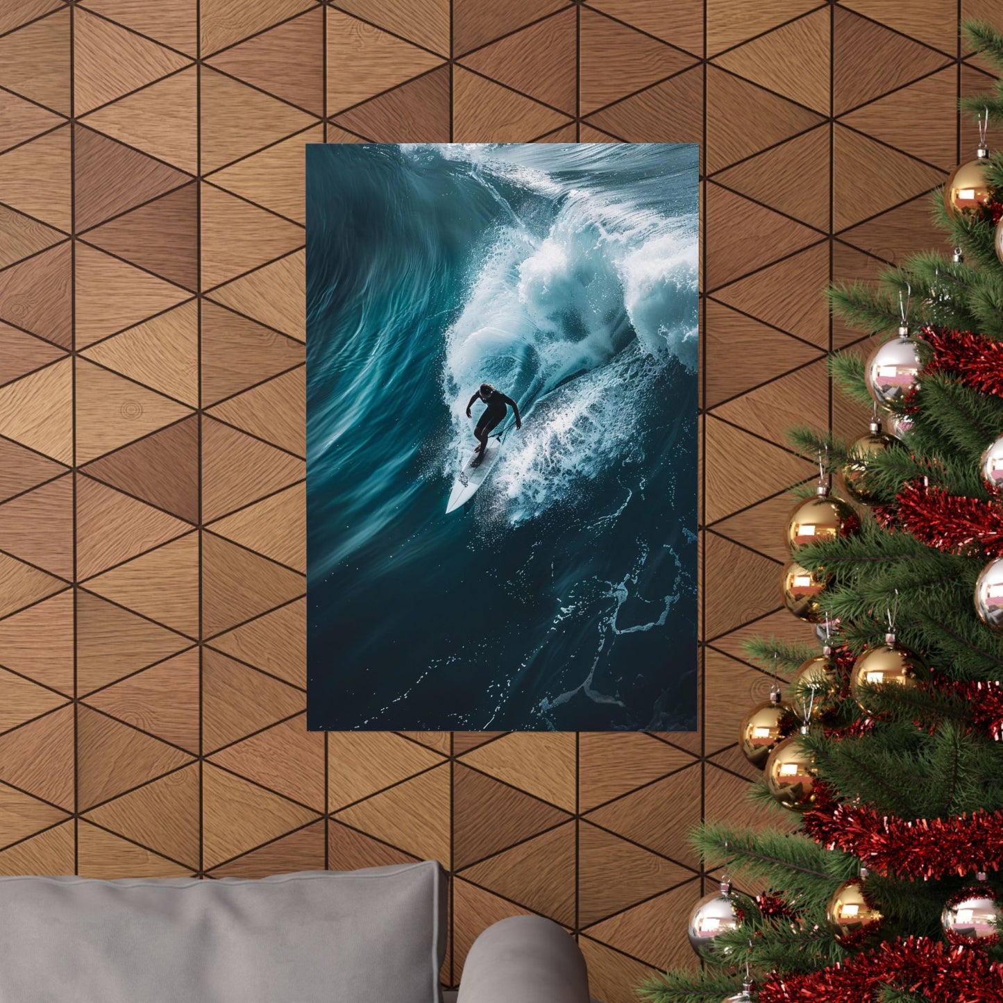 Poster of a surfer on a wave hanging on a geometric-patterned wall with a Christmas tree to the right.