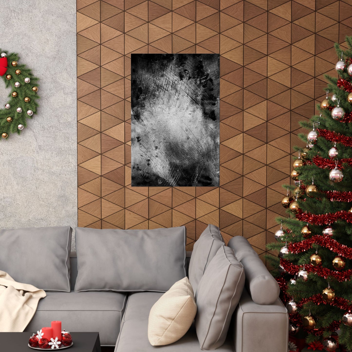 Living room with gray sofa, Christmas tree, and geometric wall design.