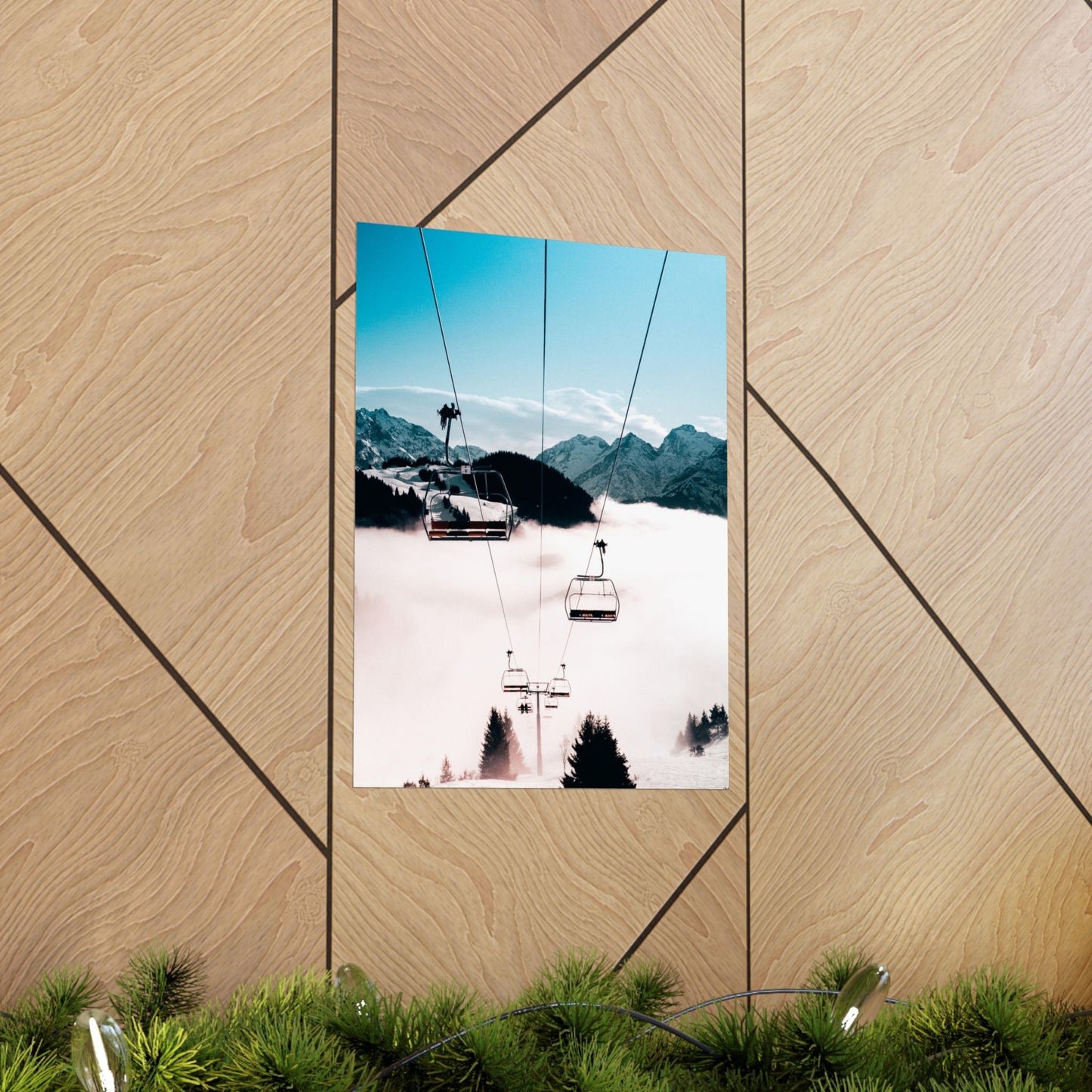 Ski lift with mountains in the background on a wooden wall.