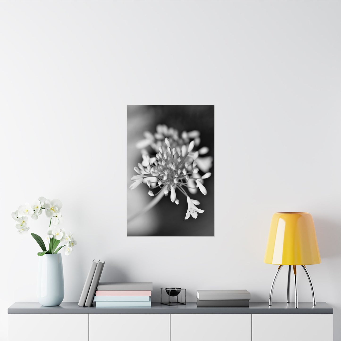 Floral artwork on a wall above a table with decor items