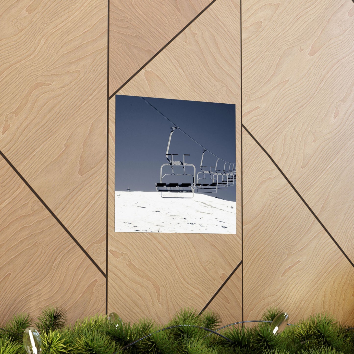 Ski lift against a blue sky on a wooden wall with geometric patterns