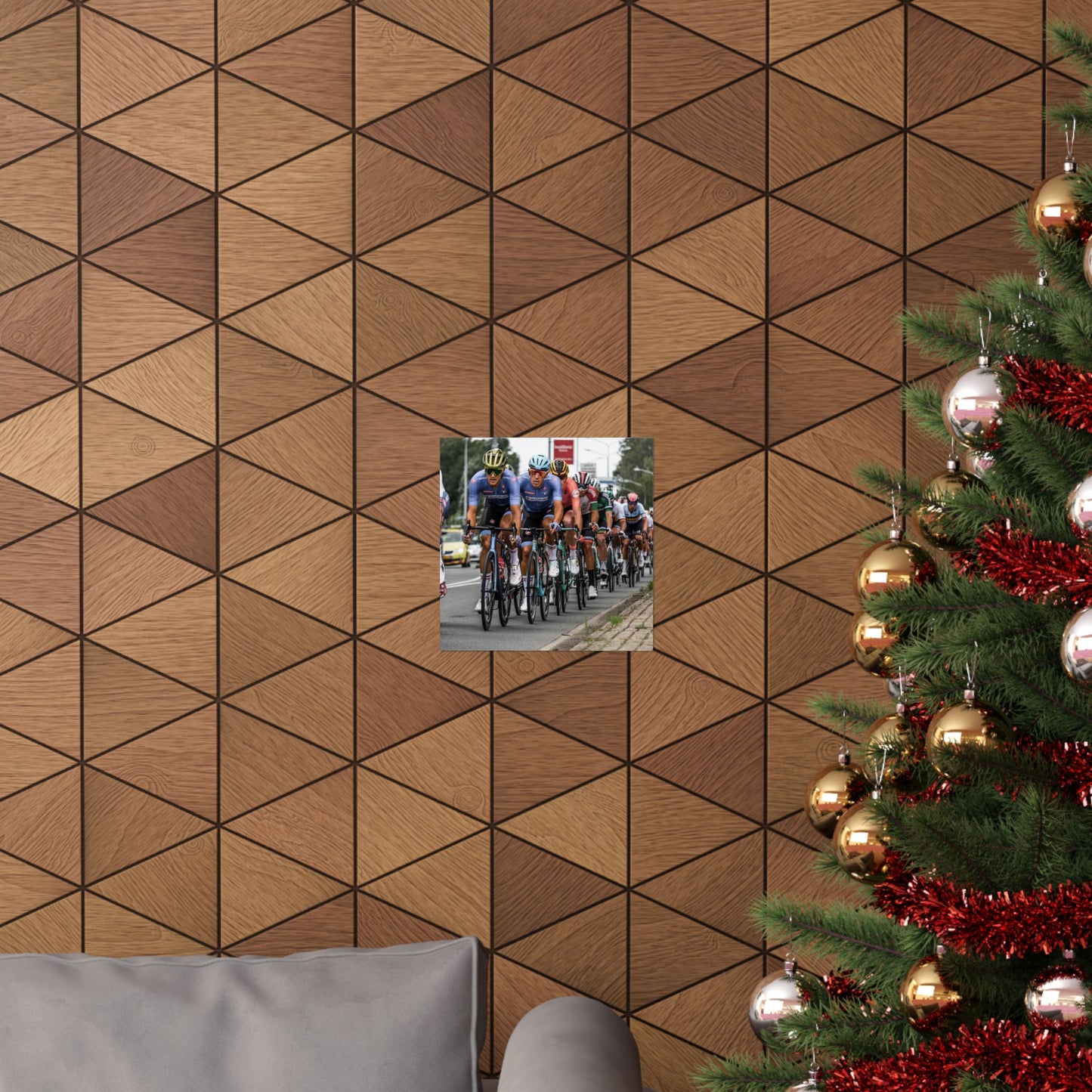 Wooden wall with geometric pattern, small inset photo of cyclists, and Christmas tree with decorations.