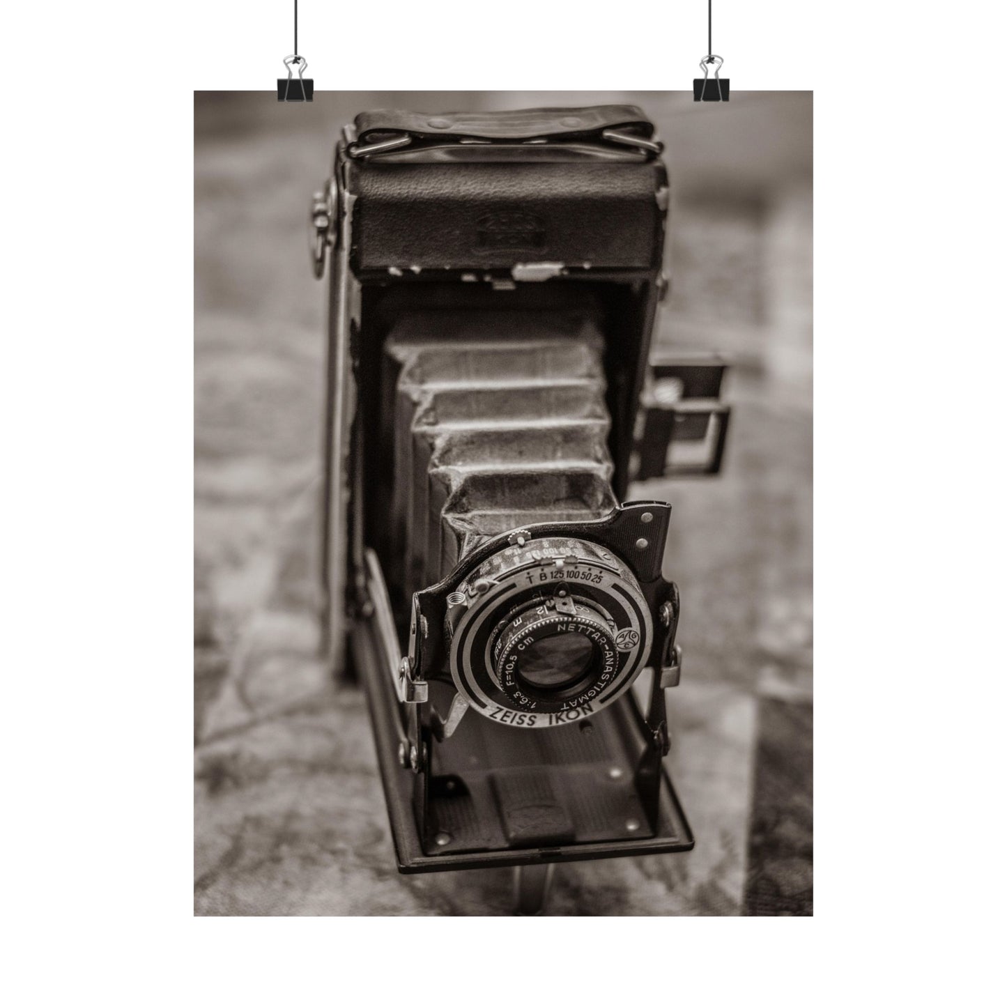Vintage camera in black and white on a textured background